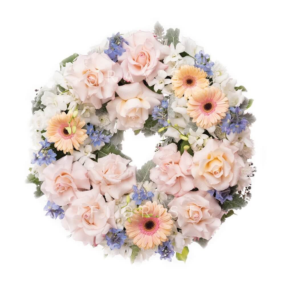 Pastel Pink, Blue & White Funeral Wreath with Seasonal Flowers